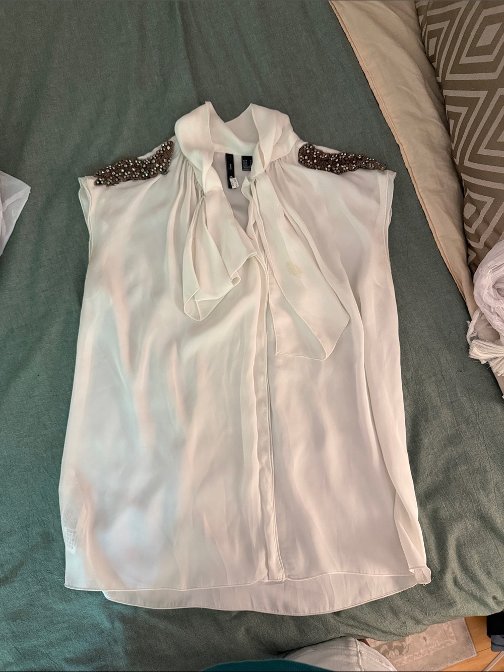 Sleeveless Cream Tie-Neck Blouse with Embellished Shoulders